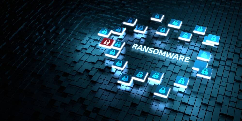 Schriftzug "Ransomware" mit digitalem Hintergrund mit in 3D-hervorgehobenen Kästen und leuchtenden Schlössern umgeben